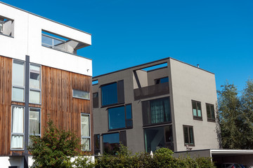 Modern apartment houses with concrete and wooden facade seen in Berlin, Germany