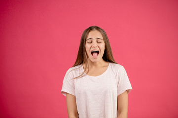 closeup image of ssinging woman with open mouth and closed eyes. hobby. like singing. warm up before the concert. sing away
