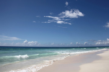 Fototapeta na wymiar Beautiful Time N Place beach with blue sky, turquiose water & white sand, Falmouth, Jamaica, Caribbean.