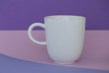 tableware mockup. Minimalist cup Mockup. white cup on a trend lilac pink  background. tableware mockup in trendy pastel tones.copy space