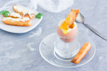 Ready-to-eat breakfast. Soft boiled chicken egg  with breadcrumbs on a stand