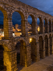 Nightly Segovia, Spain at the ancient Roman aqueduct. The Aqueduct of Segovia, located in Plaza del...