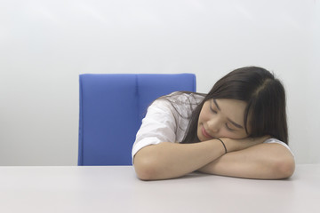 Beautiful Asian office girl napping 