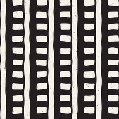 Obraz premium Hand drawn seamless repeating pattern with lines tiling. Grungy freehand background texture.