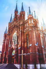 Fototapeta na wymiar The facade of Cathedral of the Immaculate Conception of the Holy Virgin Mary in Moscow, Russia. 