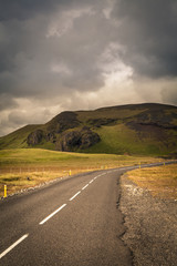 Empty road in barren Icelandic landscape