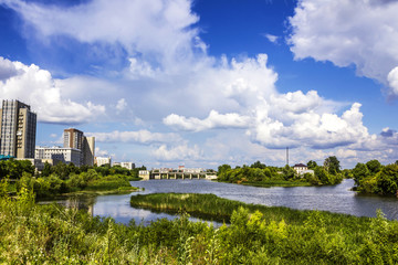 The view of Kurgan city with a dam in the background.
