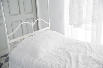 White themed bed and curtain in the morning, bedroom interior