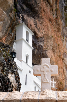 Monastery of Ostrog. Christian holy cross in rocky Serbian Orthodox monastery Ostrog, Montenegro. St. Vasilije Ostroski (upper church)
