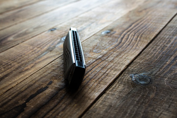 harmonica on wooden background