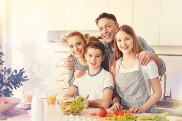 Feeling happiness. Nice kids showing their smiles and standing near their parents while looking forward