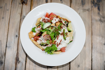 Restaurant dishes salads French fries cutlets olives