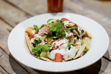 Restaurant dishes salads French fries cutlets olives