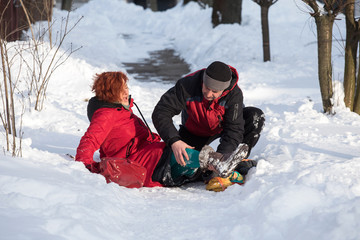 woman in pain on on snowy road
