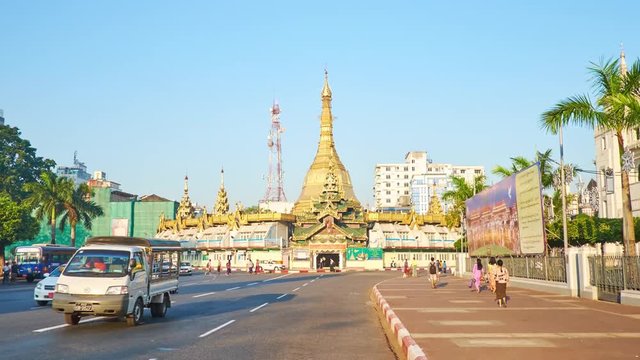 YANGON, MYANMAR - FEBRUARY 14, 2018: The golden Sule Pagoda is one of the main landmarks of Downtown, located on intersection of important roads - Maha Bandula and Sule, on February 14 in Yangon.