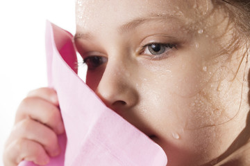 The face of little caucasian athlete after training, close-up portrait.
