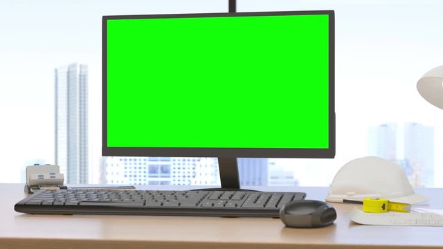 Monitor with track green screen on a desktop