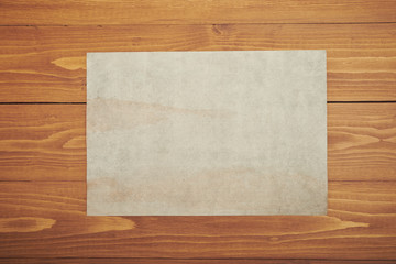Old white paper on wooden table