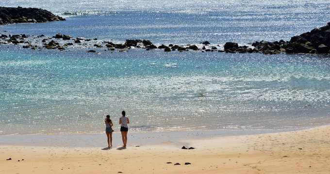  View of Playa Jablillo Beach Costa Teguise Lanzarote with two women.