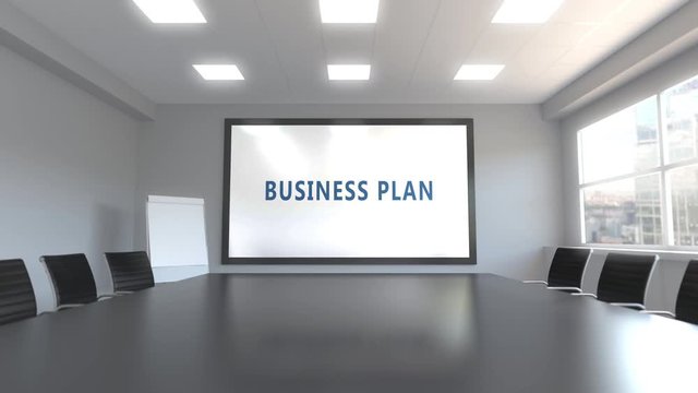 BUSINESS PLAN caption on the screen in a meeting room