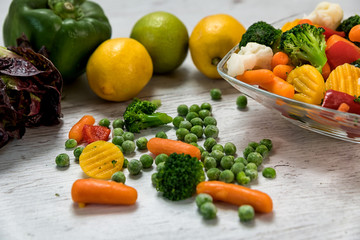 Raw vegetables cut in myskish several kinds of vegetables to prepare food laid on the table