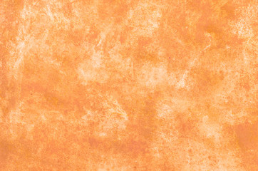 Abstract orange background. The surface of concrete or metal.