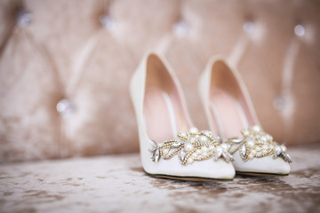 Fototapeta na wymiar Elegant and stylish bridal shoes. Selective focus.
