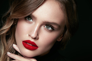 Beautiful Woman Face With Makeup And Red Lips.