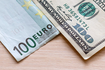 One hundred dollar bill and one hundred euro bill finance exchange concept