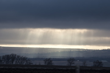 The golden sunlight through the heavy cloud before the storm coming