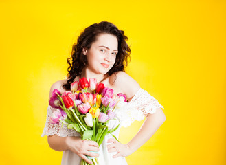 Beautiful woman with tulips in hand