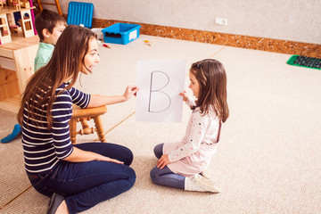 Teacher teaches the girl