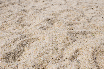 Soft wave of blue ocean on sandy beach. Background.