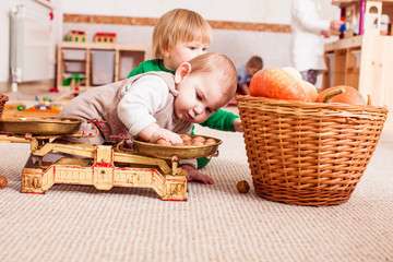 two cute boys are playing together