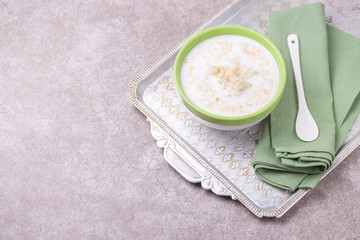 Brazilian winter festival dessert Canjica. White corn porridge