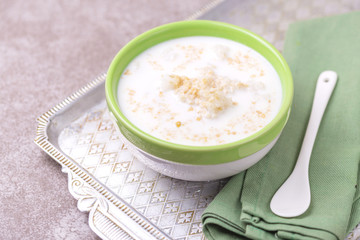 Brazilian winter festival dessert Canjica. White corn porridge