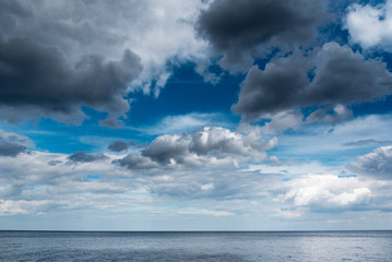 Naklejka na ściany i meble Clouds and Baltic sea.