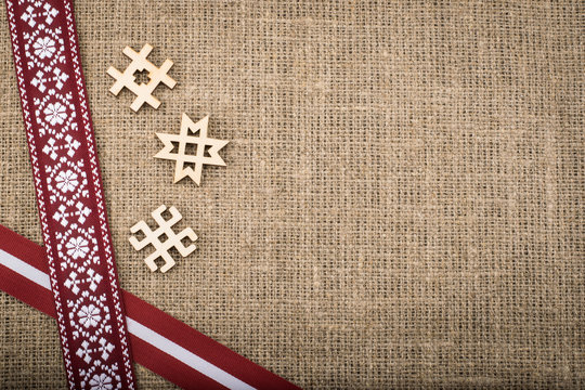 Composition of national latvian patterned ribbons and signs