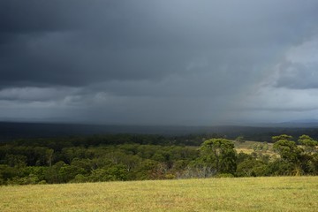 Rain moving across a rural landscape