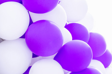 Blurred inflatable balloons of ultraviolet color year trend and white festive happy birthday background