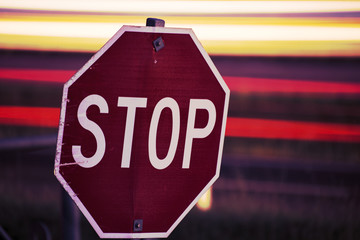 Close up of a red and white road stop sign.