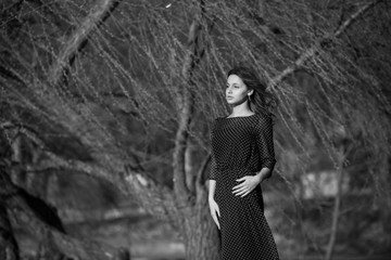 Portrait of a beautiful brunette girl on the nature. Beautiful smiling girl