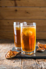 Bael juice ice tea on wooden table , healthy drink