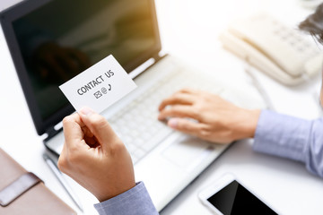 businessman and contact us concept with telephone and email