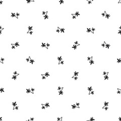 Seamless pattern of small black palm trees on a white background