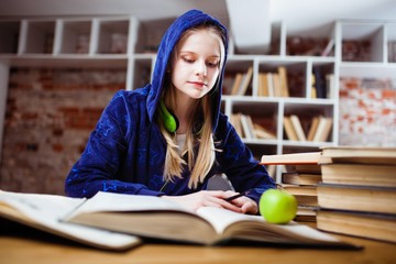 Teenage girl in a library