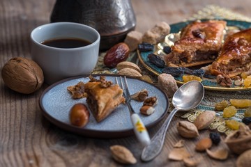 Baklava, coffee and nuts. Eastern still life.