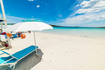 Beach umbrella by the sea in Cala Brandinchi