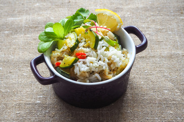 Risotto with zucchini and hot pepper. Delicious vegetarian food.
