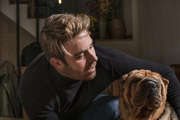 Boy looking at his dog. Feeling of love for your dog